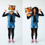 girl wearing a tiger mascot head