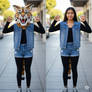 girl wearing a wildcat mascot head