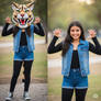 girl wearing a wildcat mascot head