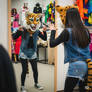 girl wearing a wildcat mascot head