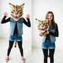 girl wearing a wildcat mascot head