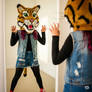 girl wearing a wildcat mascot head