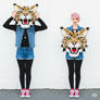 girl wearing a wildcat mascot head