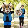 girl wearing a wildcat mascot head