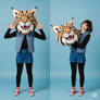 girl wearing a wildcat mascot head