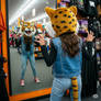 girl wearing a wildcat mascot head