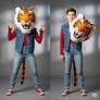 girl wearing a tiger mascot head