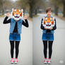 girl wearing a tiger mascot head