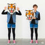 girl wearing a tiger mascot head