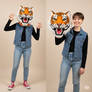 girl wearing a tiger mascot head