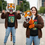 girl wearing a tiger mascot head
