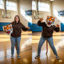 girl wearing a tiger mascot head
