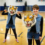 girl wearing a tiger mascot head