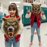 girl wearing a werewolf mascot head