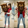 girl wearing a werewolf mascot head