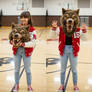 girl wearing a werewolf mascot head