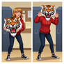 girl wearing a tiger mascot head