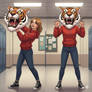 girl wearing a tiger mascot head