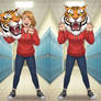 girl wearing a tiger mascot head