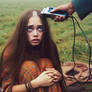 Hippie girl has her long tresses shaved c.1969