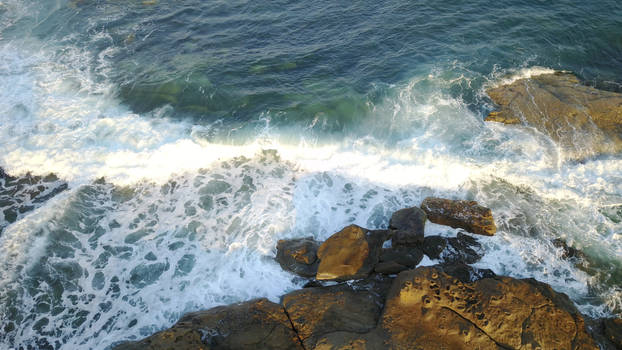 Waves Crashing over Rocks