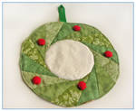 Christmas wreath mini quilt by restlesswillow