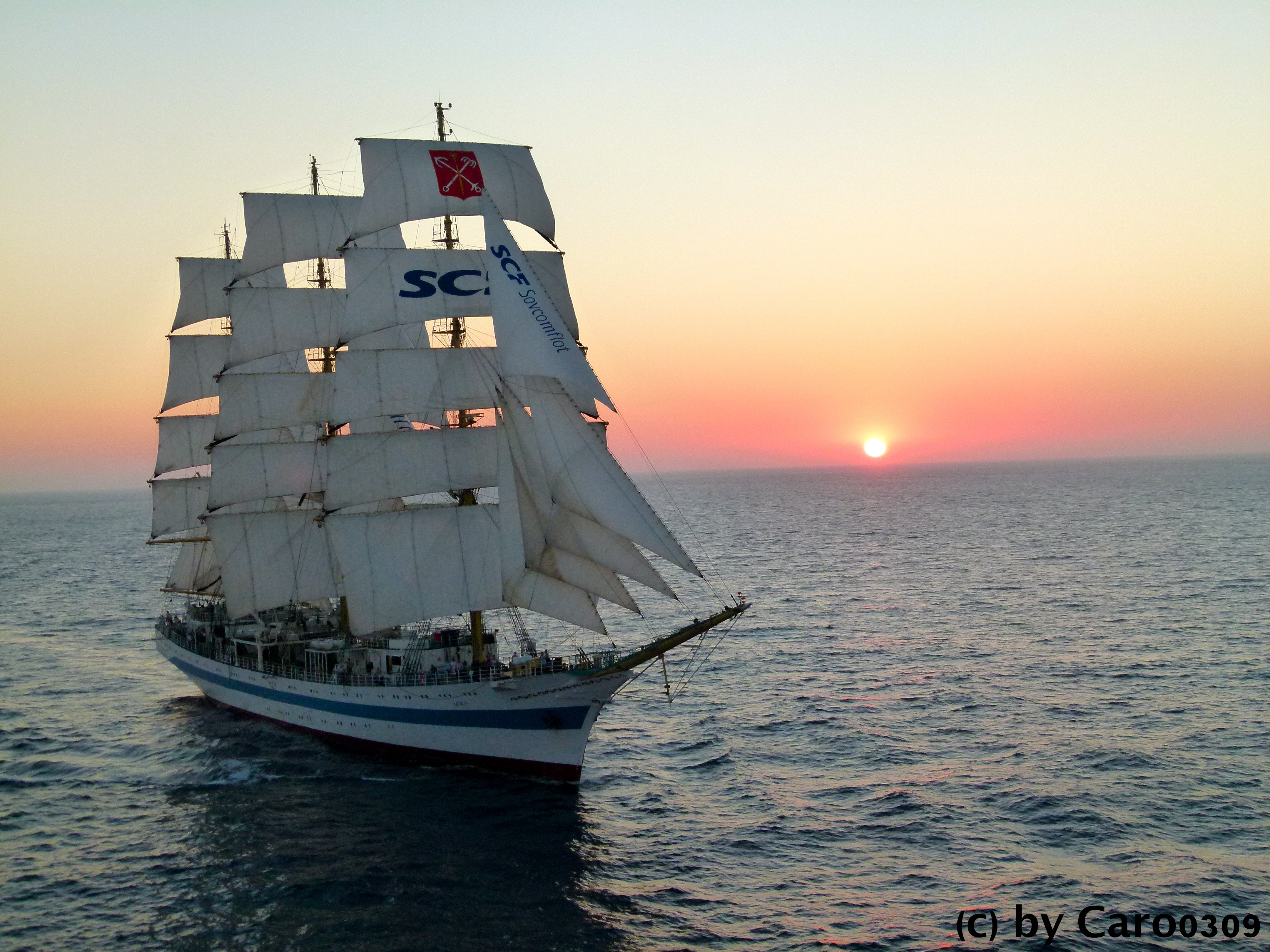 Sailing boat in sunset