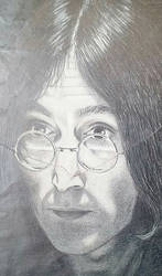 ripped portrait of John Lennon