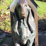 Dog in a doghouse bronze statue