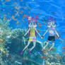Ami and Yumi Swimming Underwater Together