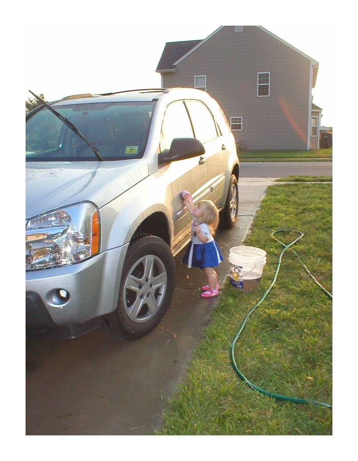 Hot Cheerleader Washing a Car