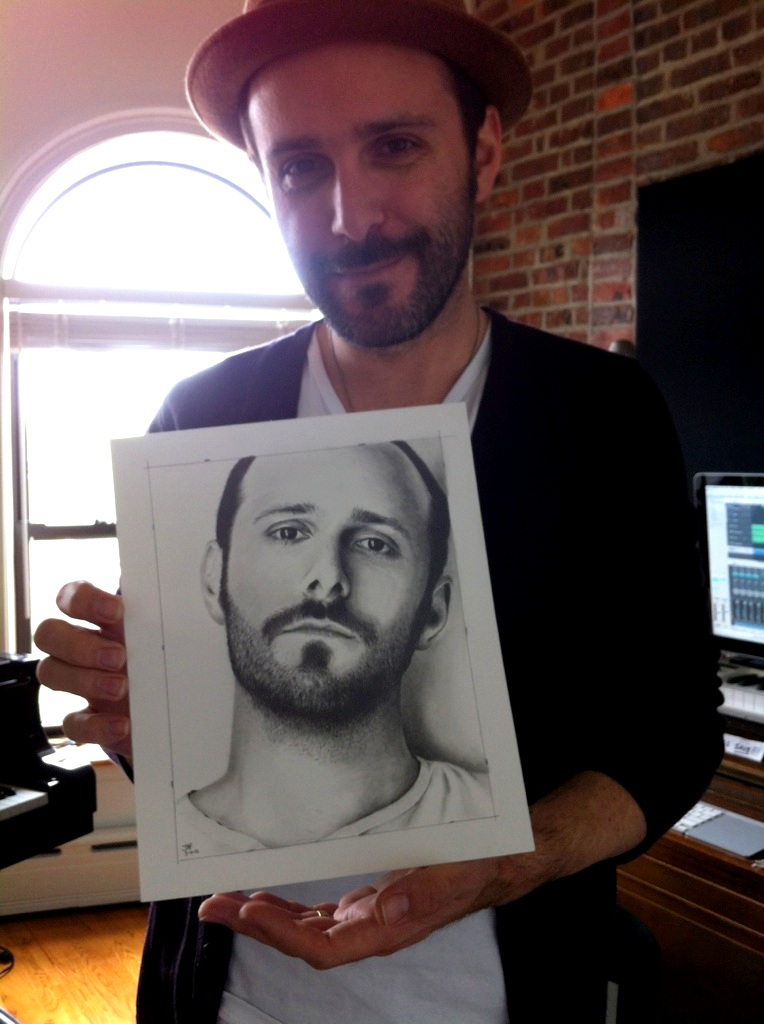 Greg Laswell holding his Drawing