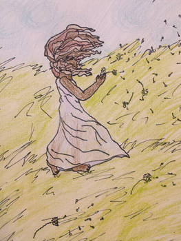 Girl standing on a hill 