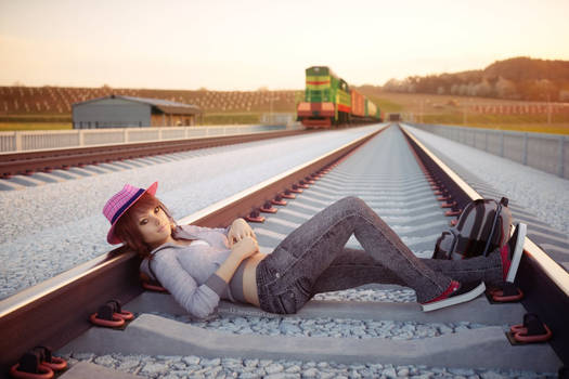 Laying across rails in field