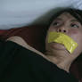 Young Vietnamese girl is tape gagged