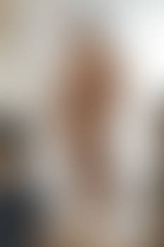 A thin man wearing muscle suit