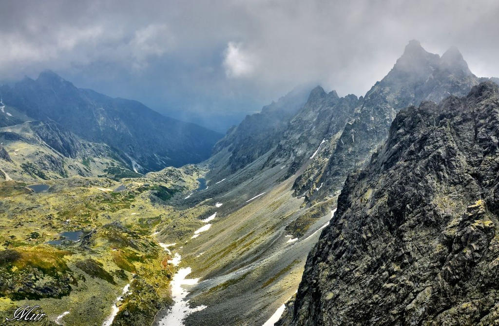 At the tops of the mountains