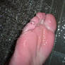 Karina naked feet under the shower