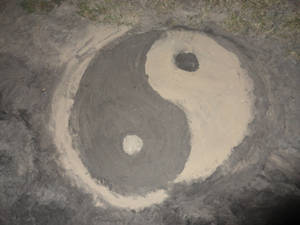 Yin Yang symbol in the sand
