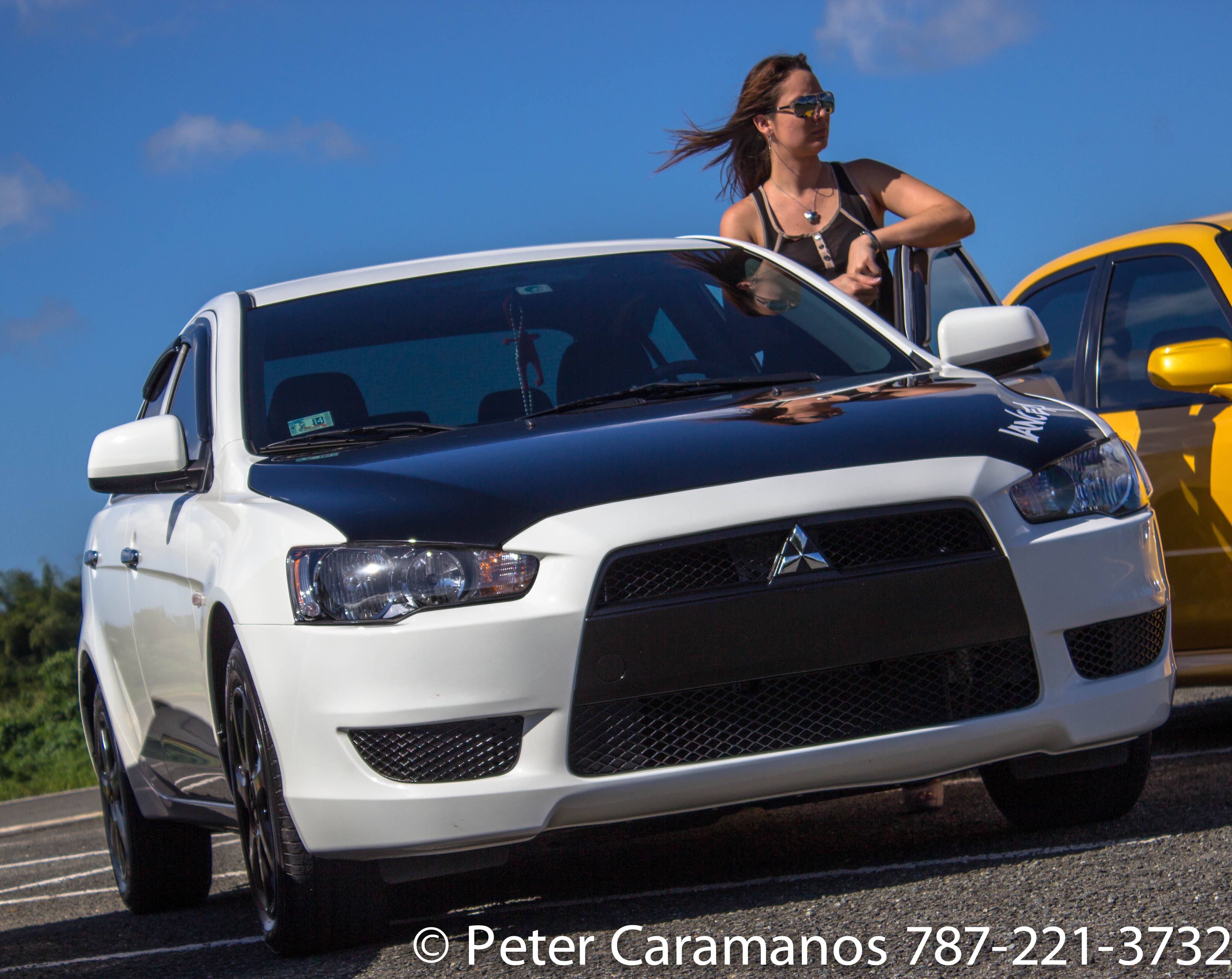 A lady and her Mitsubishi Lancer