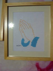 Praying hands framed