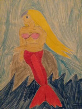 Mermaid Isabella posing as the mermaid statue