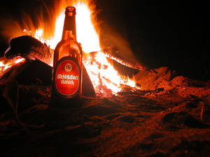Drinking at a campfire