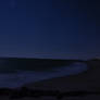 A lovely night walk on a moon lit beach.