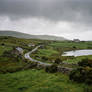 Quiet Road Beneath Storm Clouds.