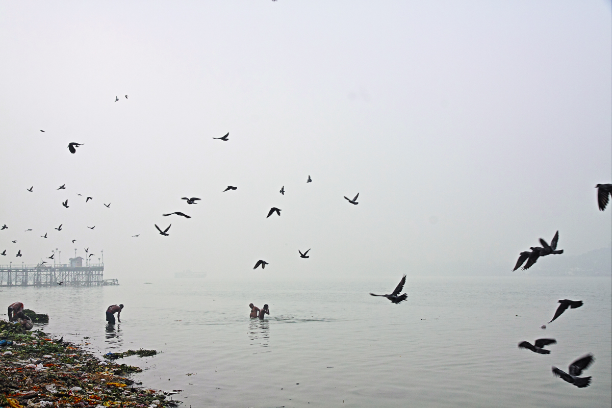 Bathers and devotees at the Hooghly river by bingbing51