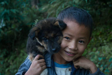 Happiness : a boy from my village and his pet