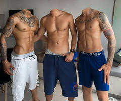 Shirtless tanned headless man with tattooed guys