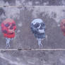 men with skulls wheatpasting