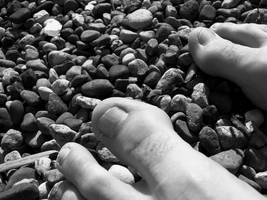 Sitting on a rocky beach